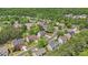 An aerial view of the homes in the neighborhood surrounded by green trees at 5870 Buckner Creek Dr, Mableton, GA 30126