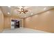 A carpeted room with neutral-colored walls, recessed lighting, and glass doors leading to another space at 5870 Buckner Creek Dr, Mableton, GA 30126