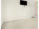 Bedroom with a mounted TV and neutral carpet flooring at 5870 Buckner Creek Dr, Mableton, GA 30126