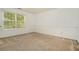 Neutral bedroom with large window for natural light and wainscotting at 5870 Buckner Creek Dr, Mableton, GA 30126
