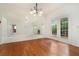 Dining room with hardwood floors, French doors, and an open view to the living room at 5870 Buckner Creek Dr, Mableton, GA 30126