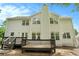 Back exterior of house featuring a deck and a bright, natural-light-filled sunroom at 5870 Buckner Creek Dr, Mableton, GA 30126