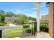 Street view from the front porch, showcasing a well-manicured lawn and landscaped surroundings at 5870 Buckner Creek Dr, Mableton, GA 30126