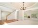 Elegant living room featuring a chandelier, fireplace, and staircase at 5870 Buckner Creek Dr, Mableton, GA 30126