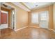 The living room features tile floors, neutral wall color, and a walkout door to the backyard at 5870 Buckner Creek Dr, Mableton, GA 30126