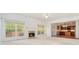 Bright living room with a cozy fireplace and a view of the outdoors at 5870 Buckner Creek Dr, Mableton, GA 30126