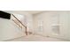 Living room featuring a staircase, bright windows, and neutral decor at 5870 Buckner Creek Dr, Mableton, GA 30126