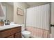 Bathroom featuring a toilet, sink, mirror, and tub/shower combo at 812 Nevis Way, Mcdonough, GA 30253