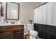 Functional bathroom with vanity, toilet, and shower featuring a neutral palette and efficient use of space at 812 Nevis Way, Mcdonough, GA 30253