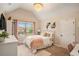 Cozy bedroom with plush bedding and a large window offering neighborhood views at 812 Nevis Way, Mcdonough, GA 30253