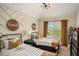 Cozy bedroom featuring two twin beds, modern light fixture, and charming wall decor for a welcoming atmosphere at 812 Nevis Way, Mcdonough, GA 30253