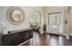 Inviting foyer with hardwood floors, high ceilings, modern decor, and arched doorway at 812 Nevis Way, Mcdonough, GA 30253