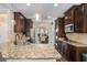 Well-equipped kitchen with granite countertops, stainless steel appliances, and ample cabinet space at 812 Nevis Way, Mcdonough, GA 30253