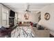 Cozy living room featuring a stone fireplace, coffered ceilings, and stylish decor at 812 Nevis Way, Mcdonough, GA 30253