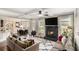 Spacious living room offering fireplace, coffered ceiling, and seamless flow to dining and kitchen at 812 Nevis Way, Mcdonough, GA 30253