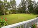 Expansive backyard with lush green lawn and volleyball net, perfect for outdoor activities at 2507 Fairweather Se Ct, Conyers, GA 30013