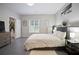 Spacious bedroom with decor, neutral paint, and a view of the green backyard at 2507 Fairweather Se Ct, Conyers, GA 30013