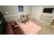 Inviting room featuring a glass-top desk and plush pink rug at 2507 Fairweather Se Ct, Conyers, GA 30013