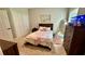 Comfortable bedroom with modern furnishings, carpet, and a decorative mirror at 2507 Fairweather Se Ct, Conyers, GA 30013