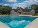 Community pool with clubhouse featuring ample space for sunbathing and lounging at 2507 Fairweather Se Ct, Conyers, GA 30013