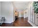 Inviting hallway with hardwood floors, elegant decor, and neutral paint colors at 2507 Fairweather Se Ct, Conyers, GA 30013