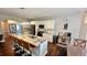 Open concept kitchen with island seating, stainless steel appliances, and an adjoining dining area at 2507 Fairweather Se Ct, Conyers, GA 30013