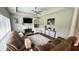 Cozy living room features a fireplace, ceiling fan, and hardwood floors at 2507 Fairweather Se Ct, Conyers, GA 30013