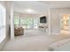 Spacious primary bedroom featuring neutral colors, sitting area, and plenty of natural light at 2507 Fairweather Se Ct, Conyers, GA 30013