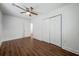Bright bedroom features wood floors, ceiling fan, and closet at 75 Meldon Se Ave, Atlanta, GA 30315