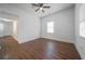 Bright and airy bedroom with wood-look floors, ceiling fan, and plenty of natural light from the windows at 75 Meldon Se Ave, Atlanta, GA 30315