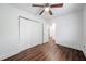 Bright bedroom features wood floors, ceiling fan, and closet at 75 Meldon Se Ave, Atlanta, GA 30315