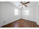 Bright bedroom featuring wood floors and a ceiling fan at 75 Meldon Se Ave, Atlanta, GA 30315