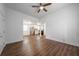 Open-concept living room featuring durable flooring, a ceiling fan, and a view into the kitchen at 75 Meldon Se Ave, Atlanta, GA 30315