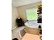 Bathroom featuring a soaking tub, vanity, and decorative shelving at 8 Dixie Dr, Stockbridge, GA 30281