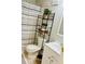 Bathroom with vanity, toilet, decorative ladder, and shower with a patterned curtain at 8 Dixie Dr, Stockbridge, GA 30281