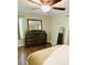 Comfortable bedroom featuring hardwood floors, large mirror, and light neutral color pallette at 8 Dixie Dr, Stockbridge, GA 30281