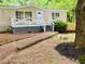 Charming home featuring a welcoming porch, neutral siding, and well-maintained front yard at 8 Dixie Dr, Stockbridge, GA 30281