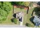 Overhead view of a home with a fenced backyard, and a well maintained lawn and landscaping at 1625 Brisbane Dr, Dacula, GA 30019