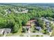A home is nestled among beautiful green trees in a well-maintained neighborhood, with a construction site nearby at 1625 Brisbane Dr, Dacula, GA 30019