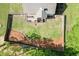 Aerial view of home's fenced backyard with well-maintained lawn and deck perfect for entertaining at 1625 Brisbane Dr, Dacula, GA 30019