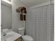 Well-maintained bathroom with patterned shower curtain, and towel rack offering a clean aesthetic at 1625 Brisbane Dr, Dacula, GA 30019