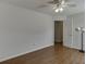 This bedroom features wood floors, ceiling fan with light, and white walls at 1625 Brisbane Dr, Dacula, GA 30019