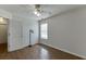 Bright bedroom features wood floors, a ceiling fan, and a window with natural light at 1625 Brisbane Dr, Dacula, GA 30019