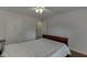 Simple bedroom with wood flooring, a comfortable sleigh bed, and ample closet space for storage at 1625 Brisbane Dr, Dacula, GA 30019