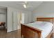 Bright bedroom with wood floors, a wood bed frame, and access to an ensuite bathroom at 1625 Brisbane Dr, Dacula, GA 30019