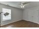 Bright, empty bedroom with wood floors, closet, and a window providing lots of natural light at 1625 Brisbane Dr, Dacula, GA 30019