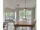 Open dining area featuring a dining table and a view of the outdoor deck at 1625 Brisbane Dr, Dacula, GA 30019