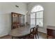 Bright dining room with a large window, chandelier, and hardwood floors perfect for hosting gatherings at 1625 Brisbane Dr, Dacula, GA 30019