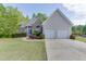 Charming single-Gathering home with a two-car garage, well-manicured lawn, and appealing curb appeal at 1625 Brisbane Dr, Dacula, GA 30019