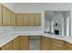 Functional kitchen with bright countertops, updated appliances, and plenty of cabinet space for storage at 1625 Brisbane Dr, Dacula, GA 30019